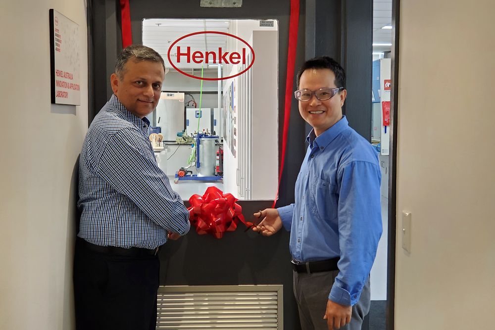Aamir Qureshi (left), Operations & Supply Chain Manager, and Stephen Liu (right), Product Development Chemist, cutting the ribbon to mark the official opening of the upgraded Innovation and Application Lab of Henkel Adhesive Technologies in Sydney. 