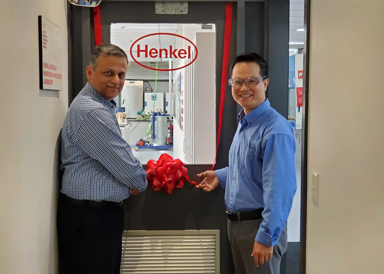 Aamir Qureshi (left), Operations & Supply Chain Manager, and Stephen Liu (right), Product Development Chemist, cutting the ribbon to mark the official opening of the upgraded Innovation and Application Lab of Adhesive Technologies in Sydney. 