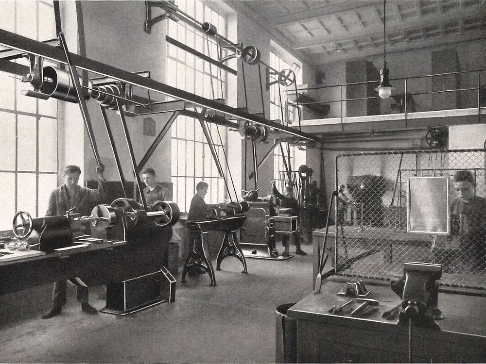 Apprentices working on machines in the metalworking workshop